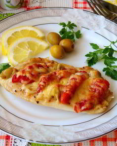 Тилапия запеченная в духовке с помидорами