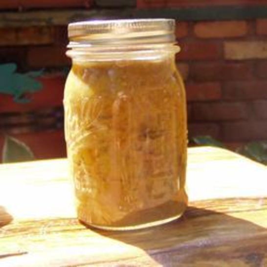 Рецепт заготовки из зеленых помидоров с яблоками и луком